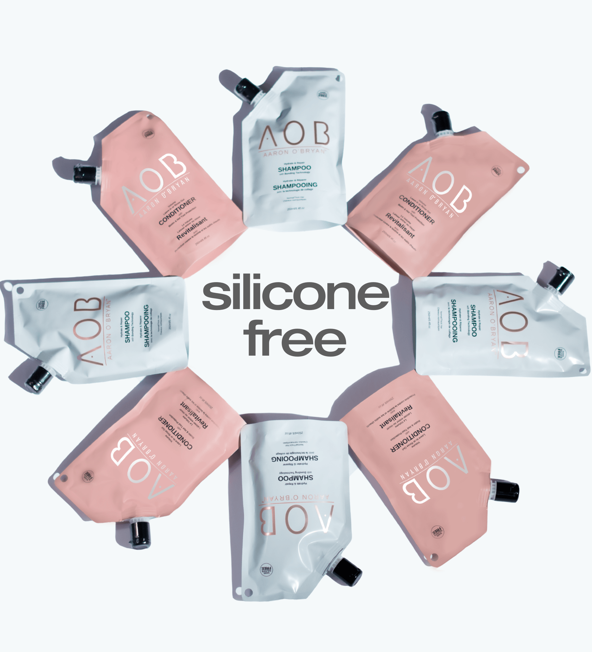 AOB Shampoo & Conditioner Pouches laid flat in a circle with "Silicone Free" text in the middle
